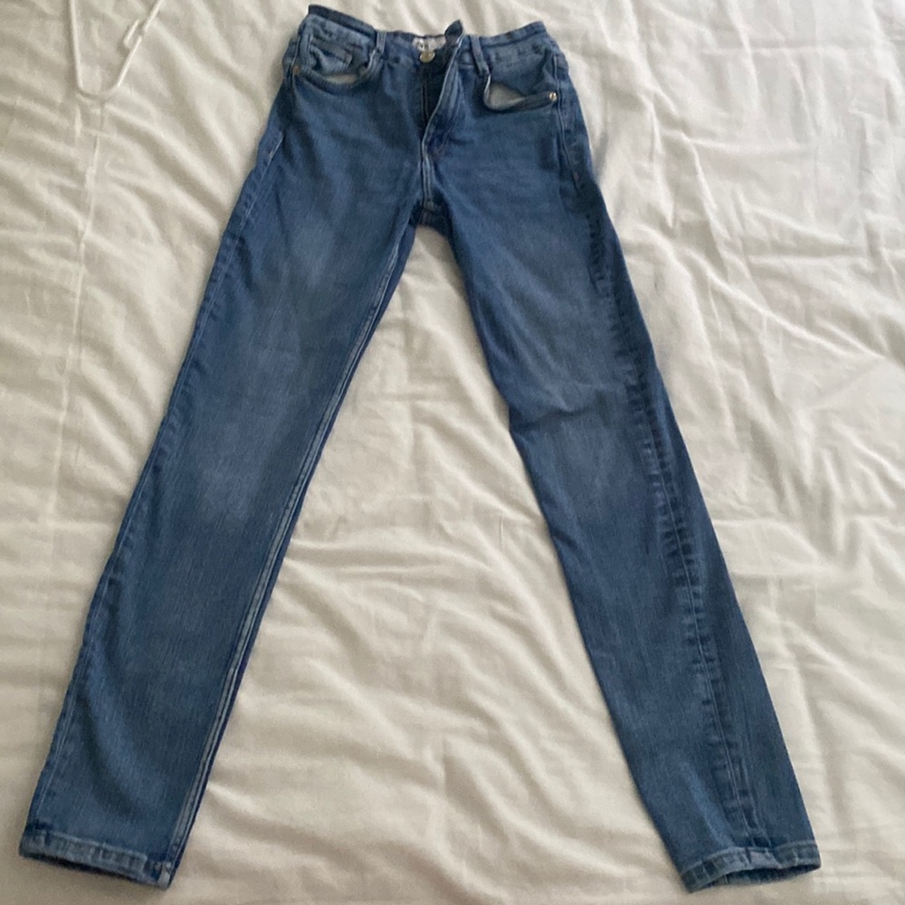 Blue skinny jeans, mid-high rise (Zara)